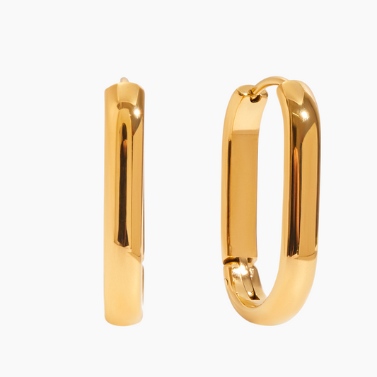 Gold hoop earrings on a white background