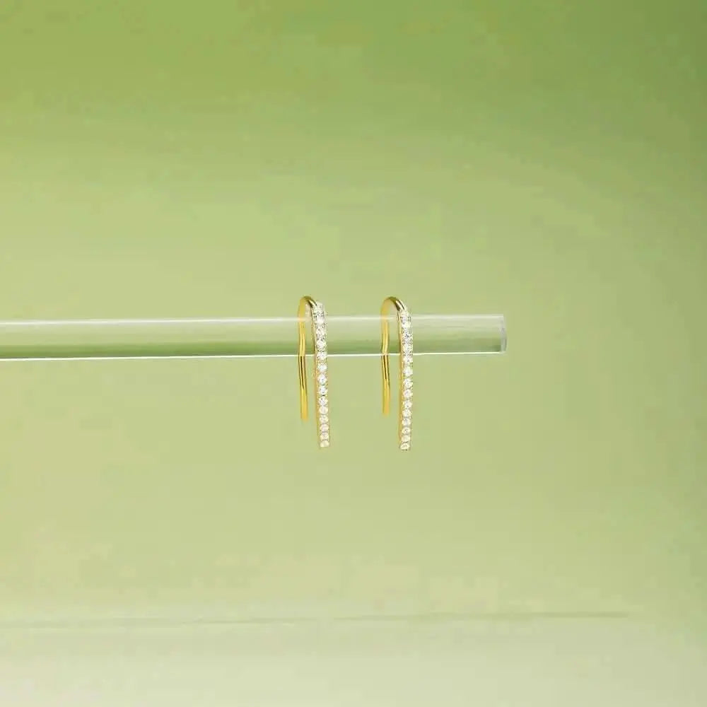 Slim Gold Threader Earrings – Sleek and simple, these gold threader earrings are a must-have for any minimalist jewelry lover. Their linear design and sparkling stones bring a refined fi