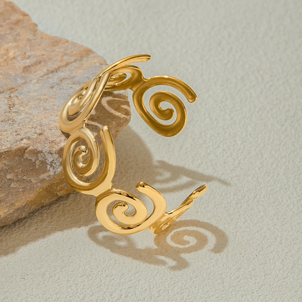 Swirl-inspired cuff shown in beachy light, perfect for poolside outfits
