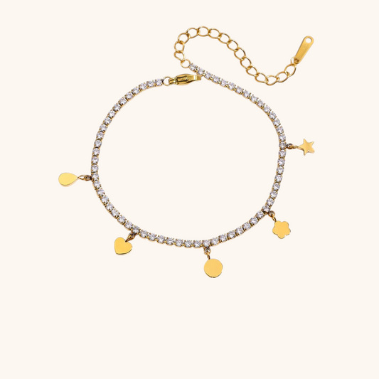 Close-up of charm tennis bracelet with star, heart, and flower pendants