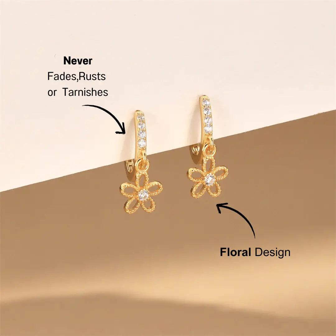 Sparkling Daisy Hoop Earrings with a flower-shaped design and zircon crystals, set against a minimal background.