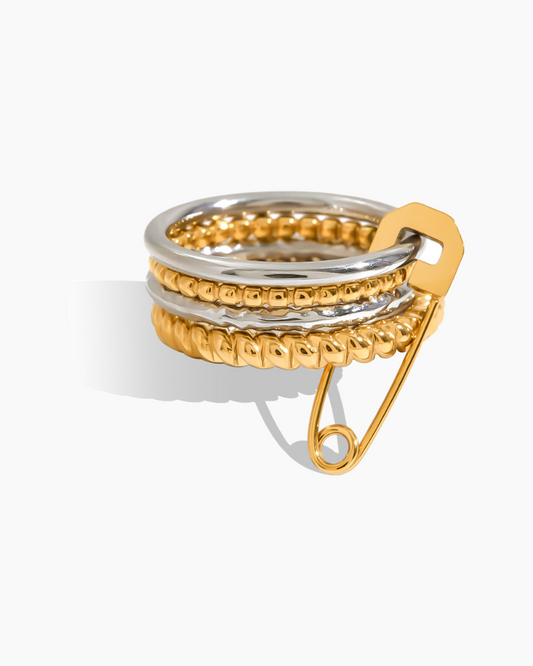 Stack of gold and silver rings on a white background