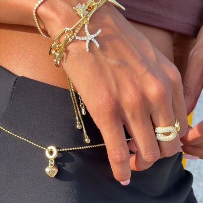 Duo Curve Pave ring styled with delicate stacking rings on finger.