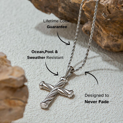 stainless steel cross necklace with textured design, displayed on white background