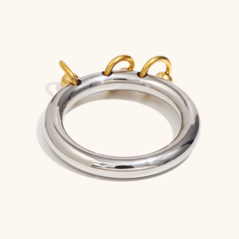 Sleek silver ring enhanced with minimalist golden charms, perfect for daily wear