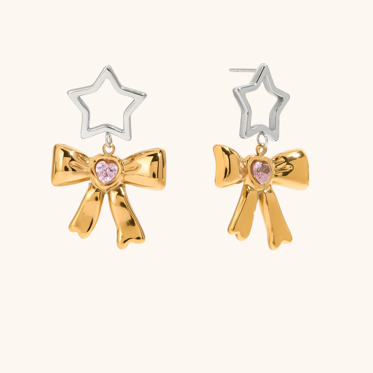 Gold star-shaped and pink heart bow earrings with playful charm