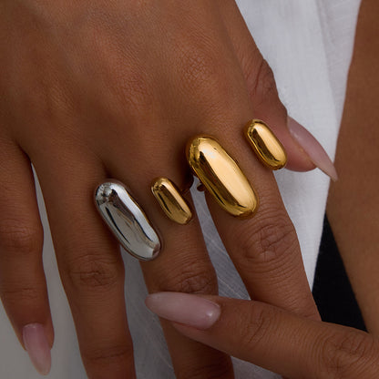 Fashionable woman styling mixed metal open rings, perfect for party or dinner wear