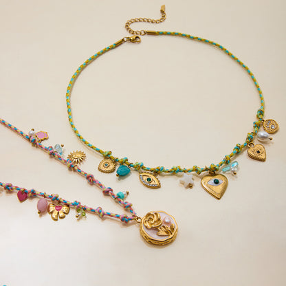 Detail shot of rose pendant and colorful beads on necklace