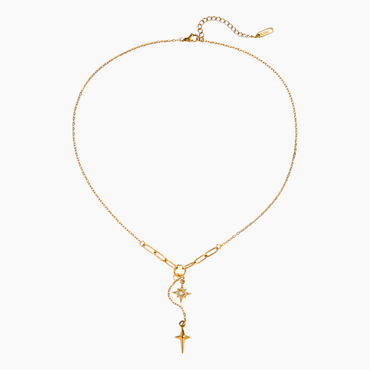 Gold necklace with star and cross pendant on a white background