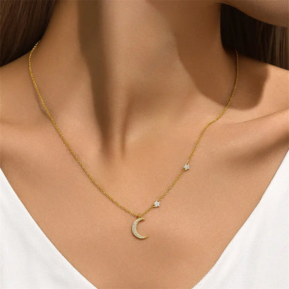 Model wearing a gold crescent moon necklace with sparkling star details for an elegant touch.