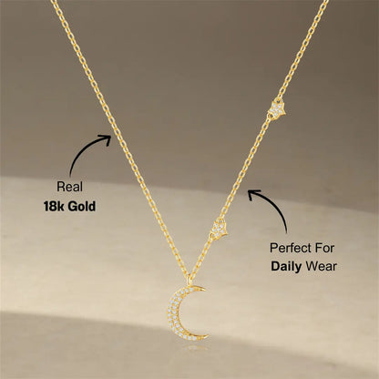 A detailed shot of the sterling silver crescent moon necklace with a star accent, featuring sparkling zirconia stones.