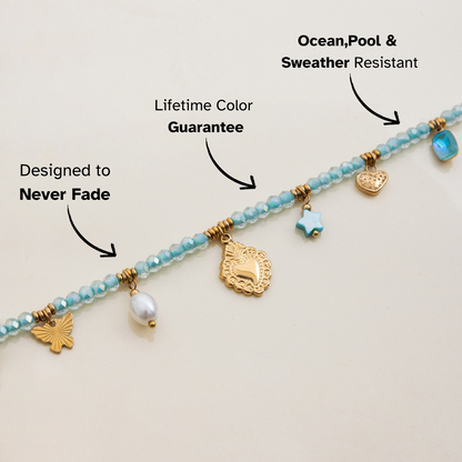 adjustable turquoise string necklace with ocean-inspired charms on beige background