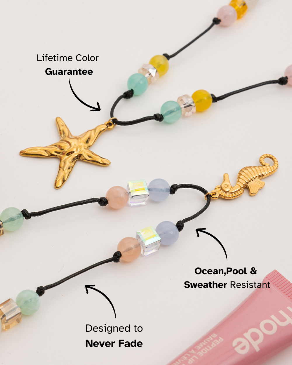 Necklace with starfish and seahorse charms on a white background, featuring text about product features.
