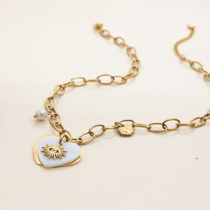Fashionable sun pendant necklace styled in summer outfit