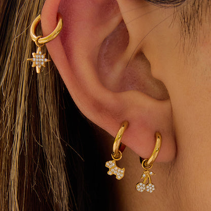 Close-up ear stack with cherry, cross and star gold hoops_MiFJewelry