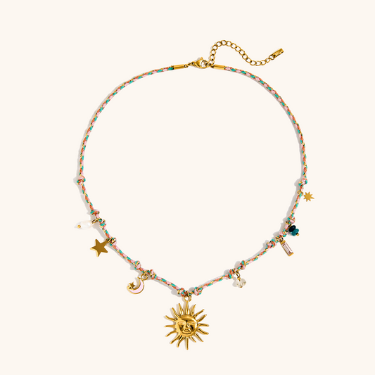 Gold sun charm necklace with braided rainbow cord