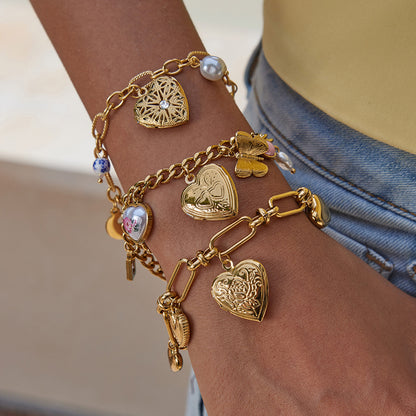 Model wearing boho-style stacked gold bracelets outdoors