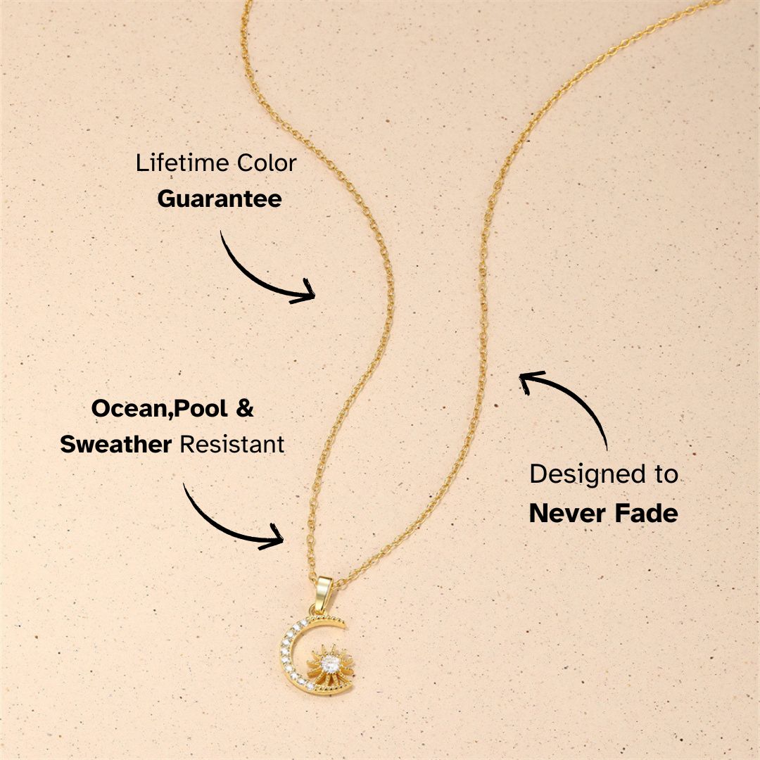 Gold sun and moon pendant necklace with sparkly accents, neutral sandy tone