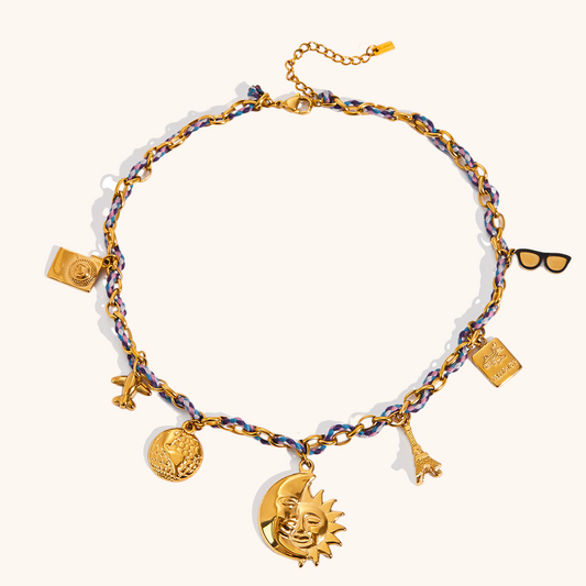 Gold sun and moon charm necklace with braided cord