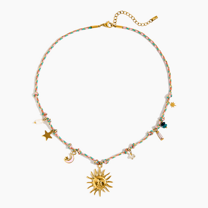 Necklace with colorful beads and gold charms on a white background
