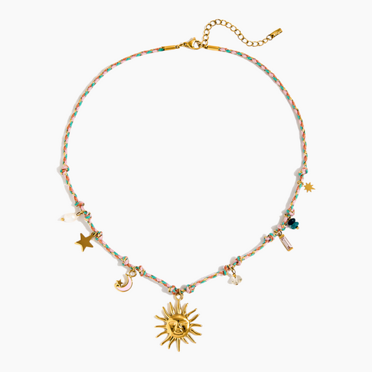 Necklace with colorful beads and gold charms on a white background