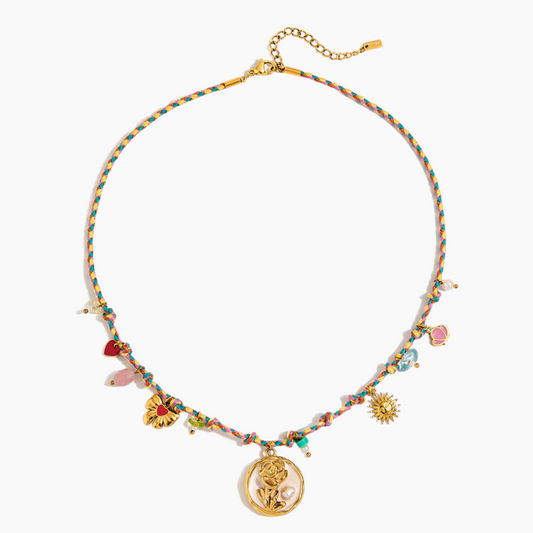 Multicolored beaded necklace with gold accents on a white background