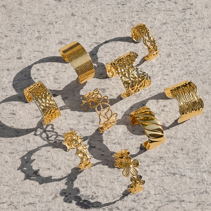 Eye-catching wide cuff bracelet with a rippled texture, perfect for summer beachwear and poolside looks.