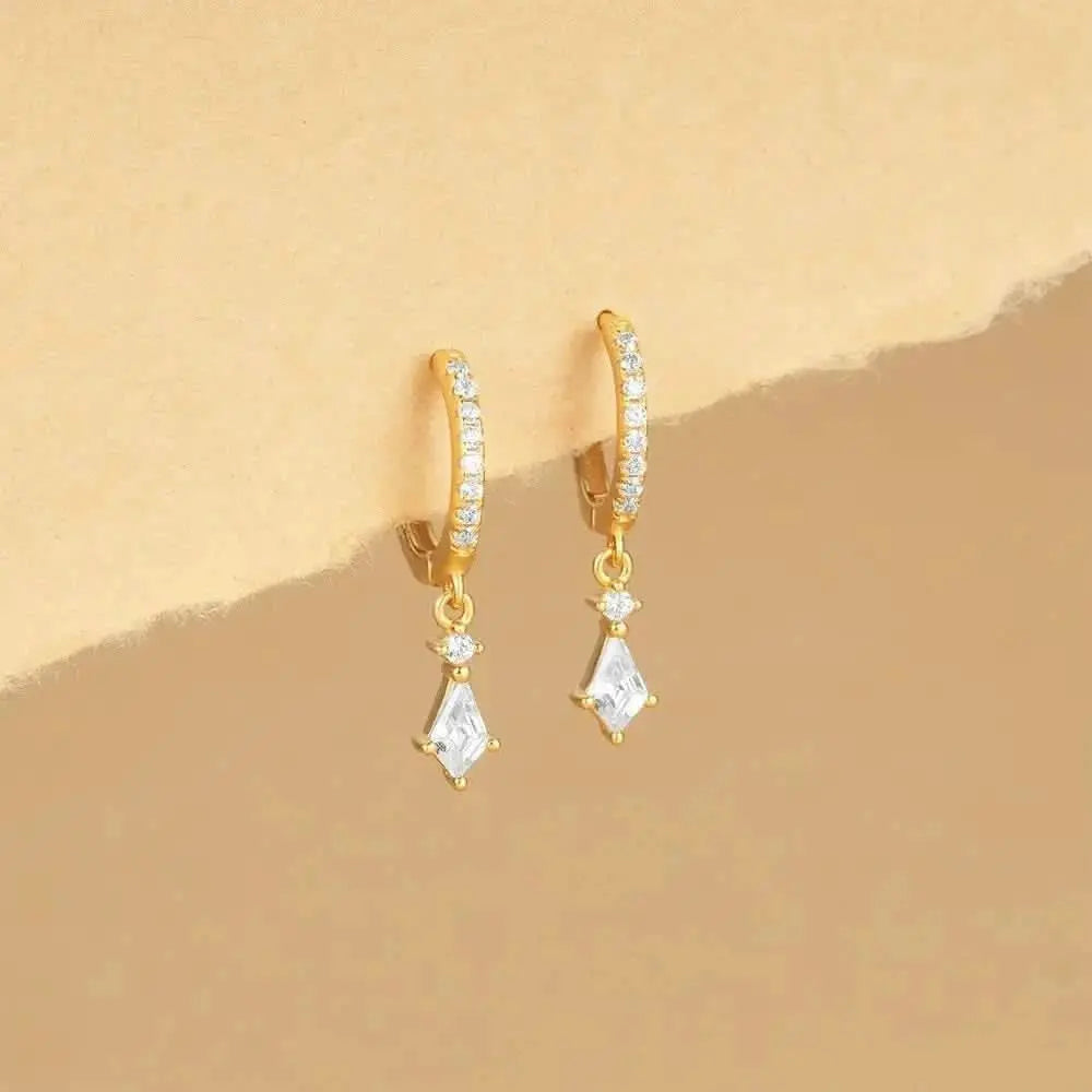 These classic gold hoops with geometric dangles add just the right amount of sparkle to any outfit.