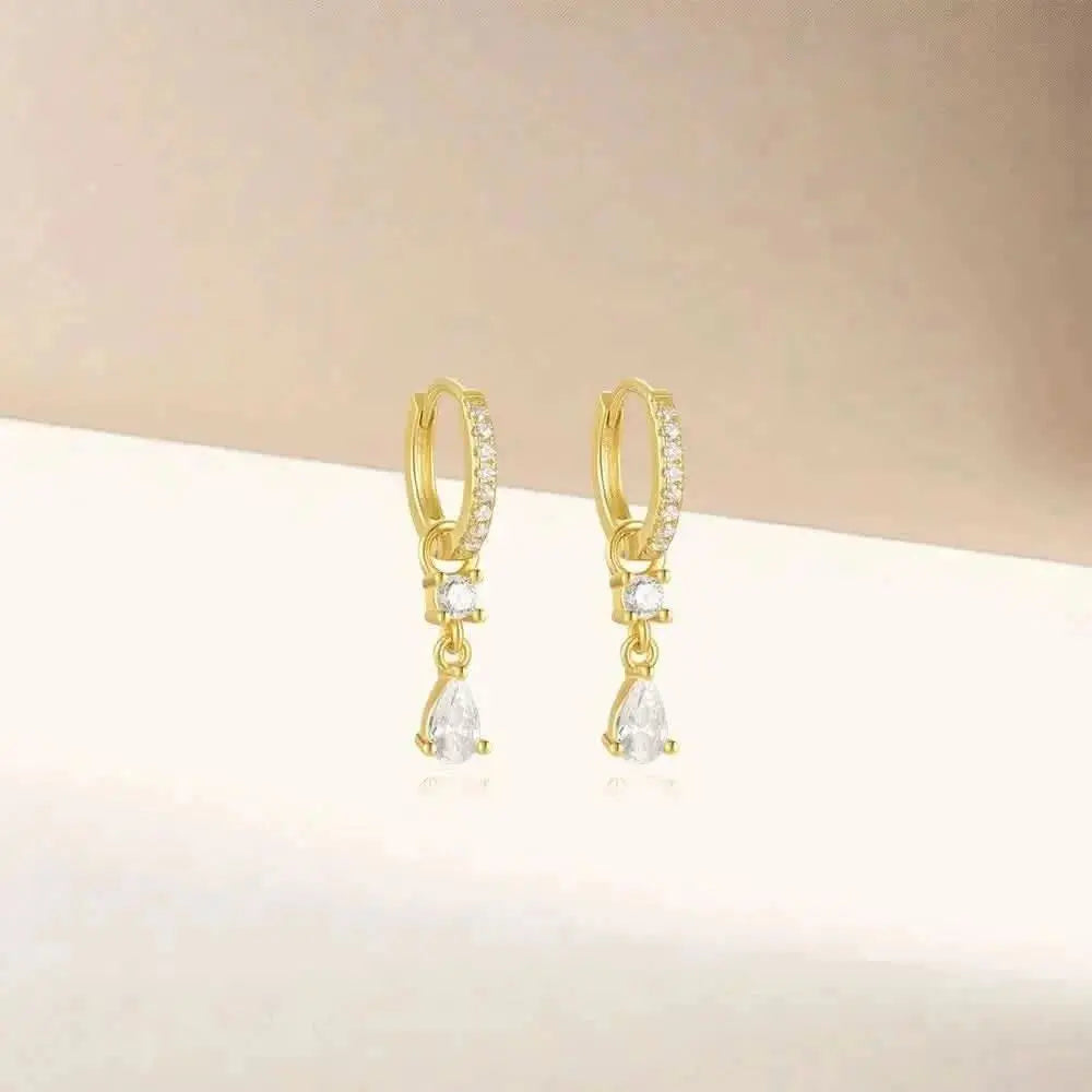 These dainty hoop earrings with sparkling teardrop dangles make for the perfect evening accessory.