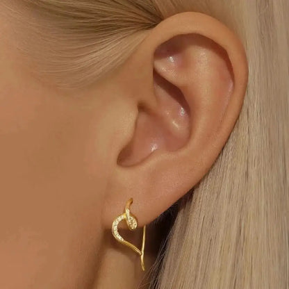 These unique heart earrings are designed to loop through the ear, creating a sophisticated and modern look.