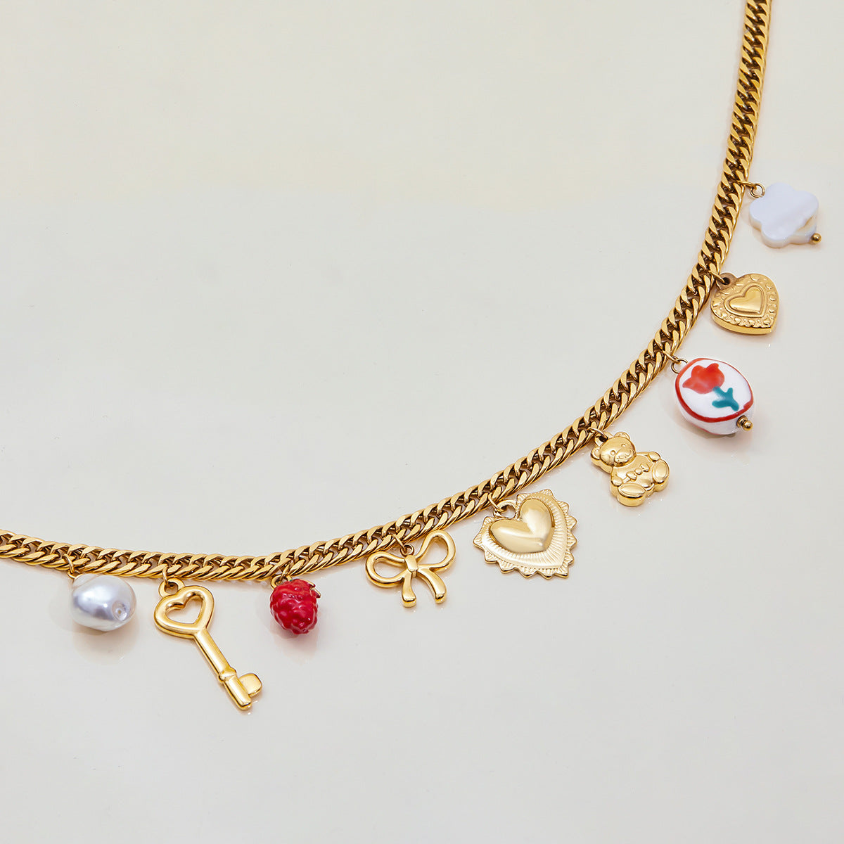Fashion necklace featuring cloud-shaped charm and heart locket