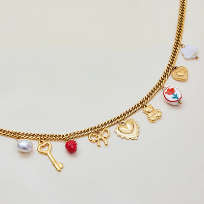 Fashion necklace featuring cloud-shaped charm and heart locket