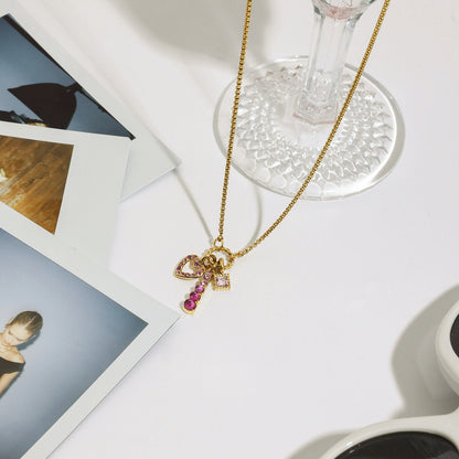 Necklace displayed on table with aesthetic props and fashion photos