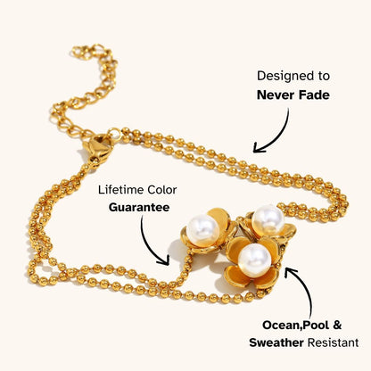 Bold gold bracelet with three blooming pearl flowers, ideal for evening wear or holiday dressing, sweatproof and non-tarnish