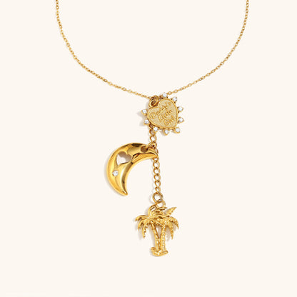 gold necklace with palm tree and crescent moon charm, engraved heart pendant