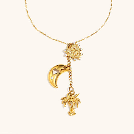 gold necklace with palm tree and crescent moon charm, engraved heart pendant