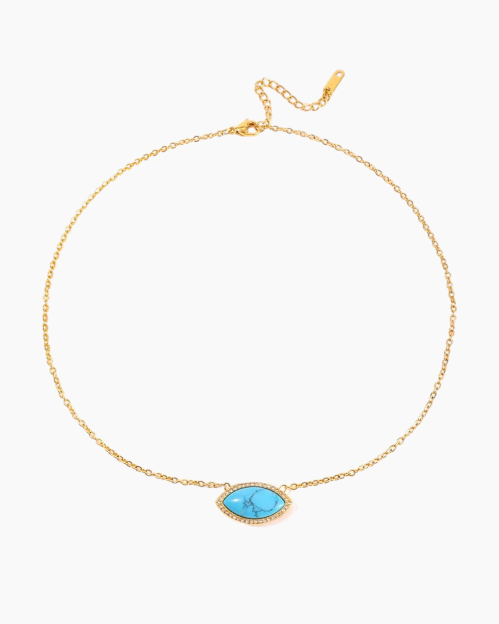 Evil eye gold necklace with turquoise stone and crystal accents against white background
