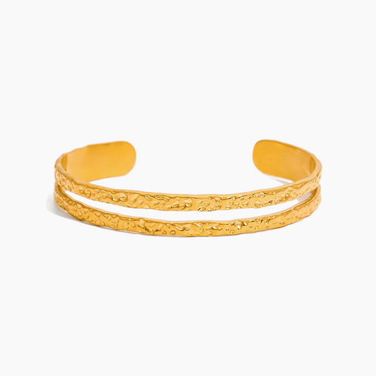 Gold bracelet on a white background