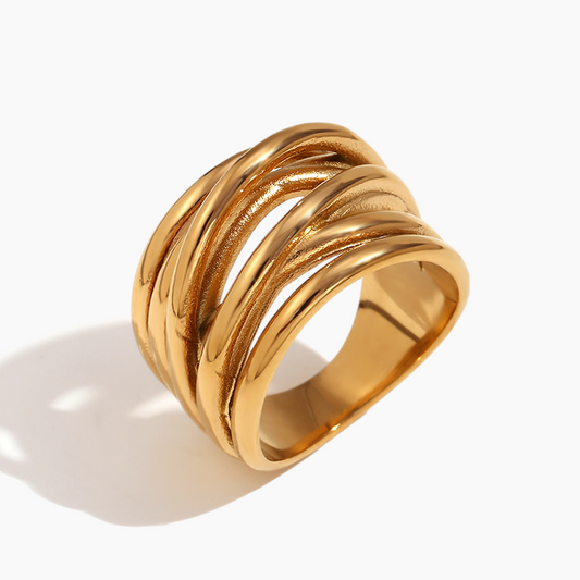 Gold ring with multiple intertwined bands on a white background