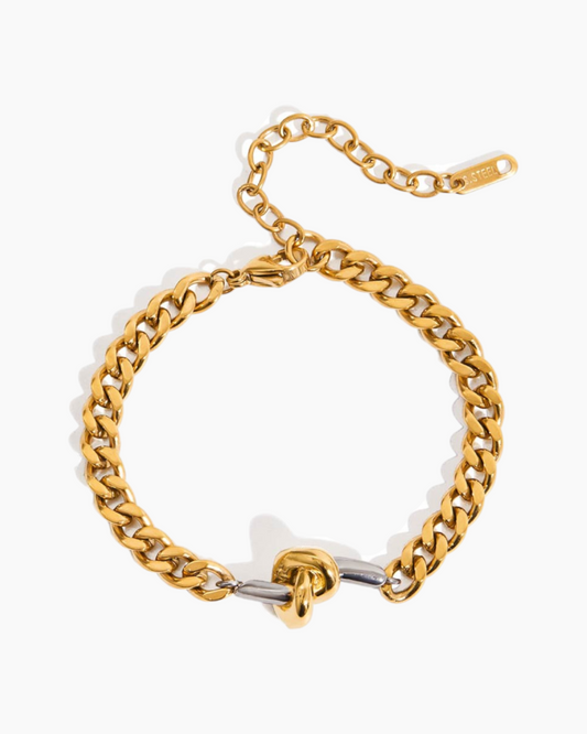 Gold chain bracelet on a white background