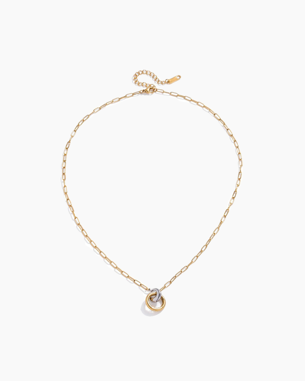 Gold necklace with a heart-shaped pendant on a white background
