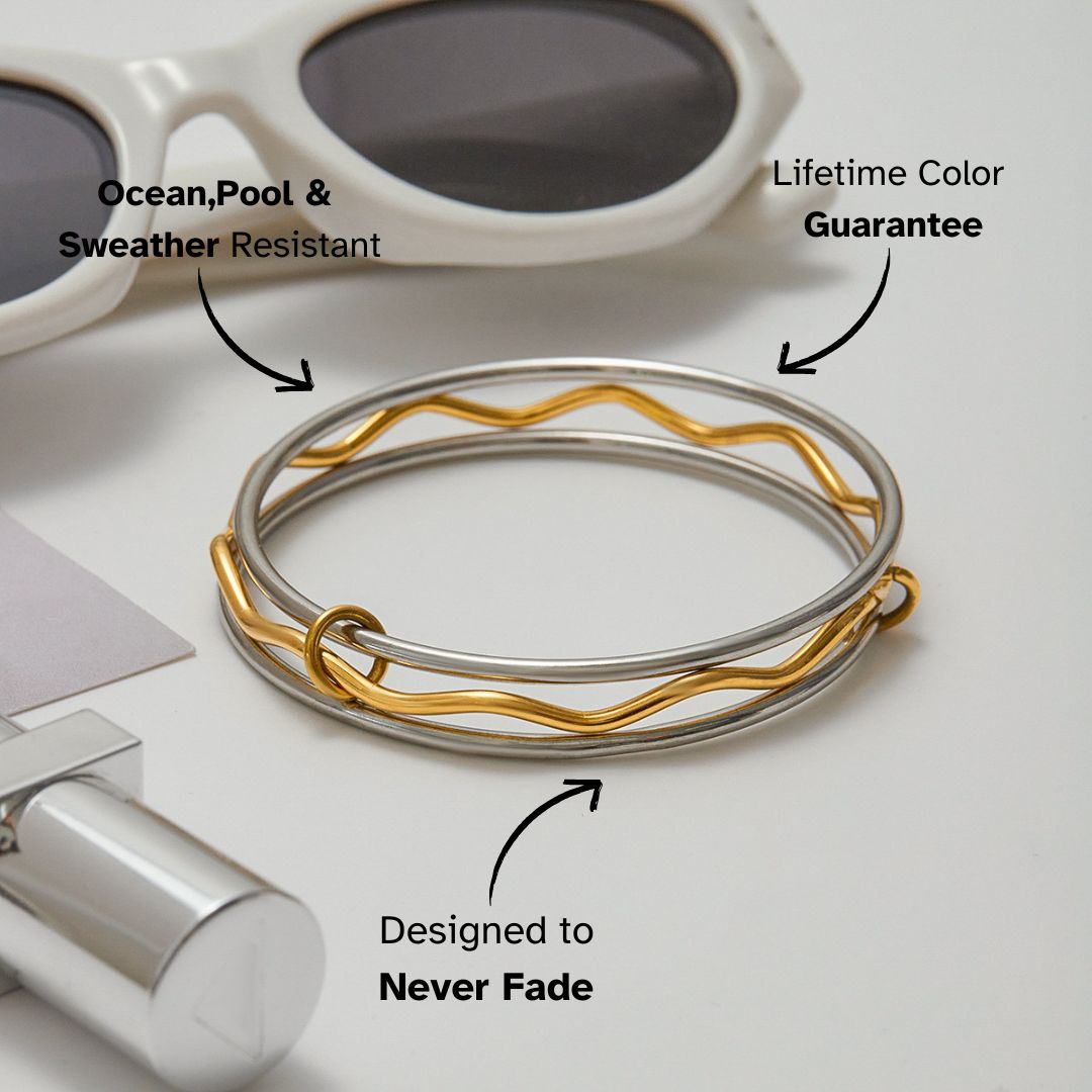 Waterproof gold and silver bangles styled with sunglasses and perfume