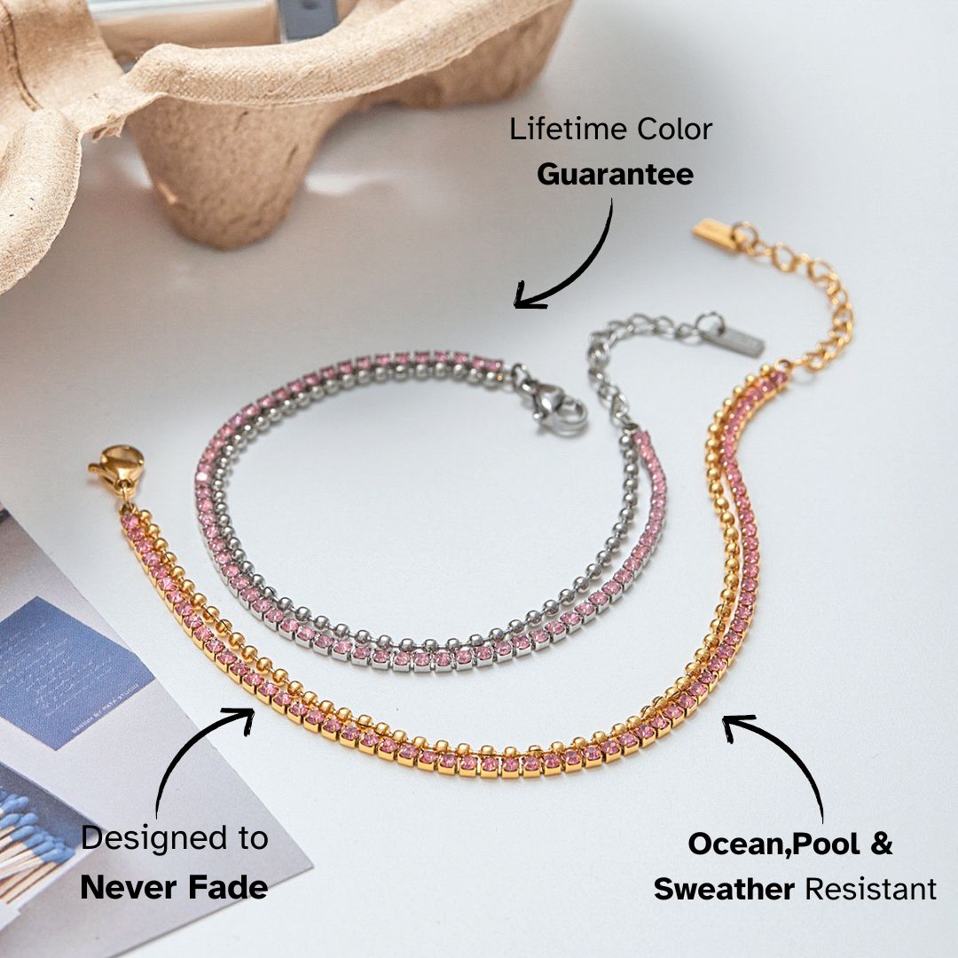 Gold and silver pink rhinestone tennis bracelet displayed on paper tray
