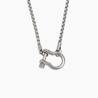 Silver necklace with a clasp on a white background