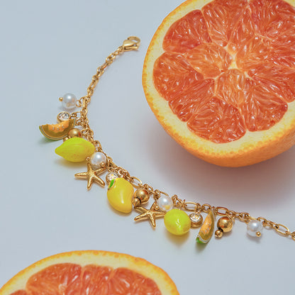Playful fruit and starfish bracelet with beach-inspired details