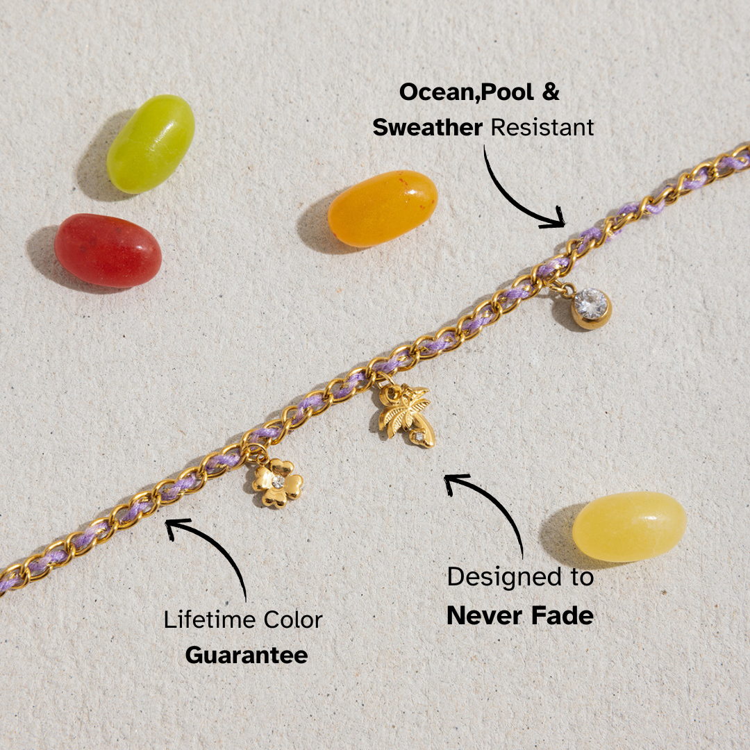 Flatlay of waterproof purple woven bracelet beside colorful jelly beans, highlighting fade-free and oceanproof features