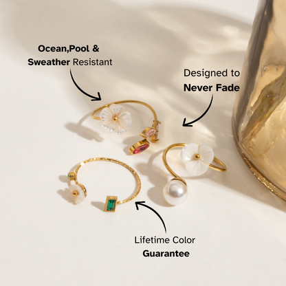 Close-up of adjustable gold ring with floral and emerald accents