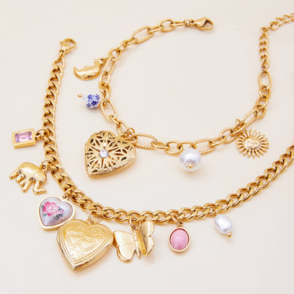 Vintage-style gold bracelet with flower locket and pearl charms