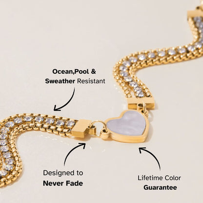 close-up of heart center charm on gold crystal chain bracelet