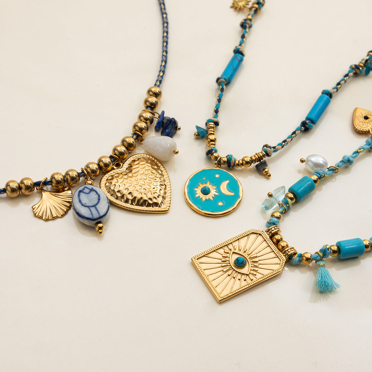 Layered boho beach necklaces with blue cords and gold beads
